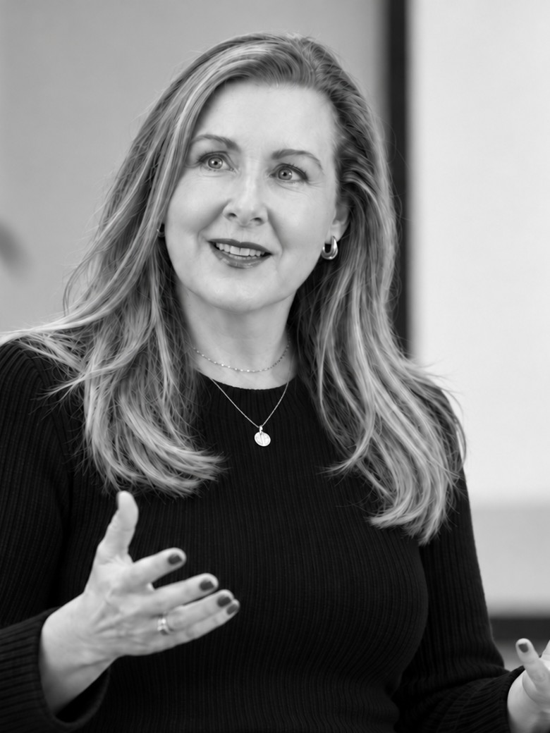 Mary Dee speaking and gesturing during a Vox London session